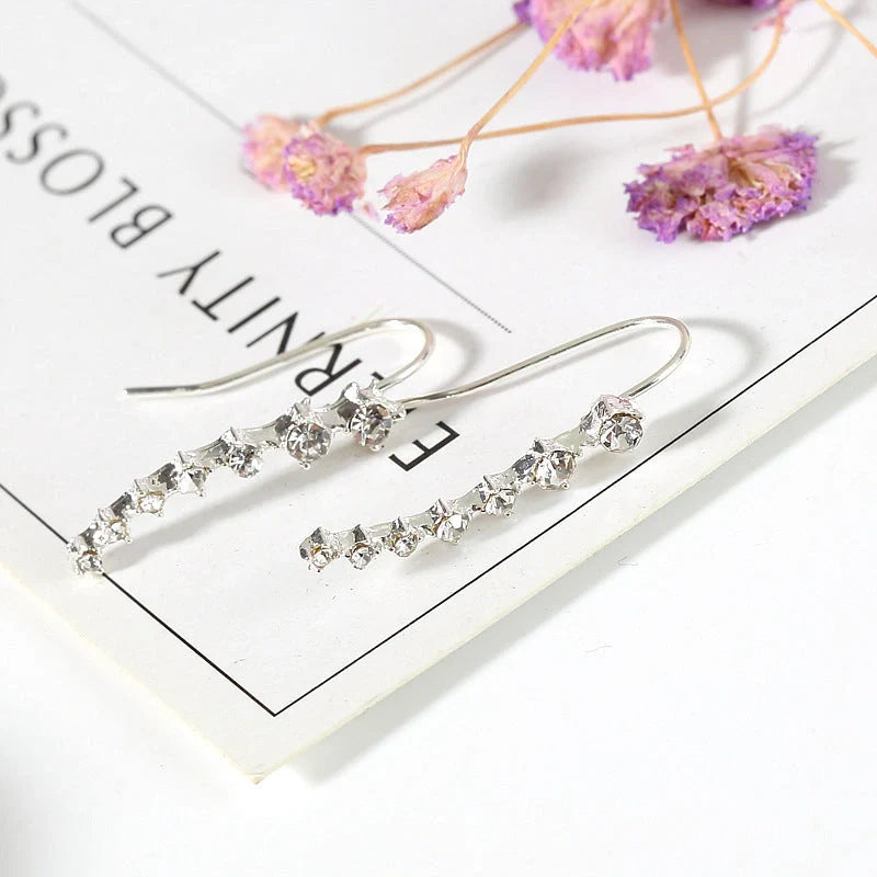 Elegant 7-inch rhinestone bridal earrings sparkling on a white background