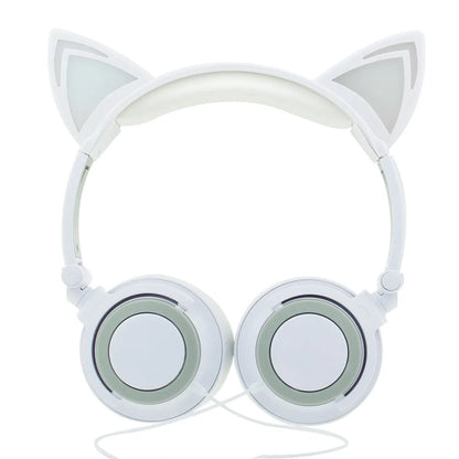 Colourful LED cat ear headphones with illuminated ears and cushions on a black background
