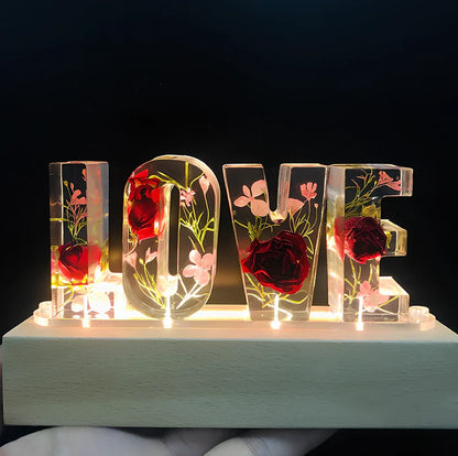 Wooden LOVE letter table lamp with dried flowers and warm LED light for bedroom use