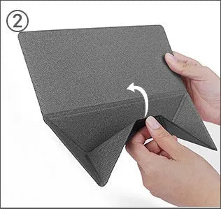 Blue or grey foldable laptop cooling stand with anti-slip surface on a desk.