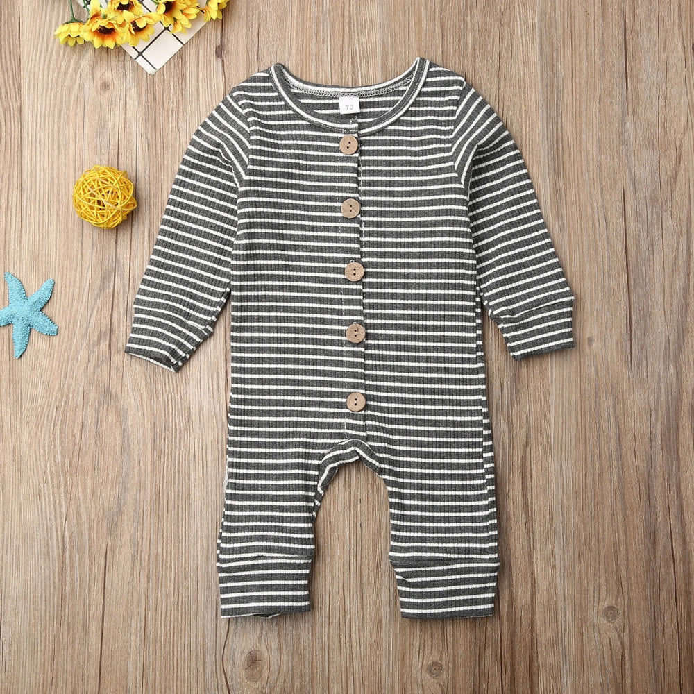 Newborn wearing a striped knitted jumpsuit in cotton, sizes 70-100cm, available in six colours