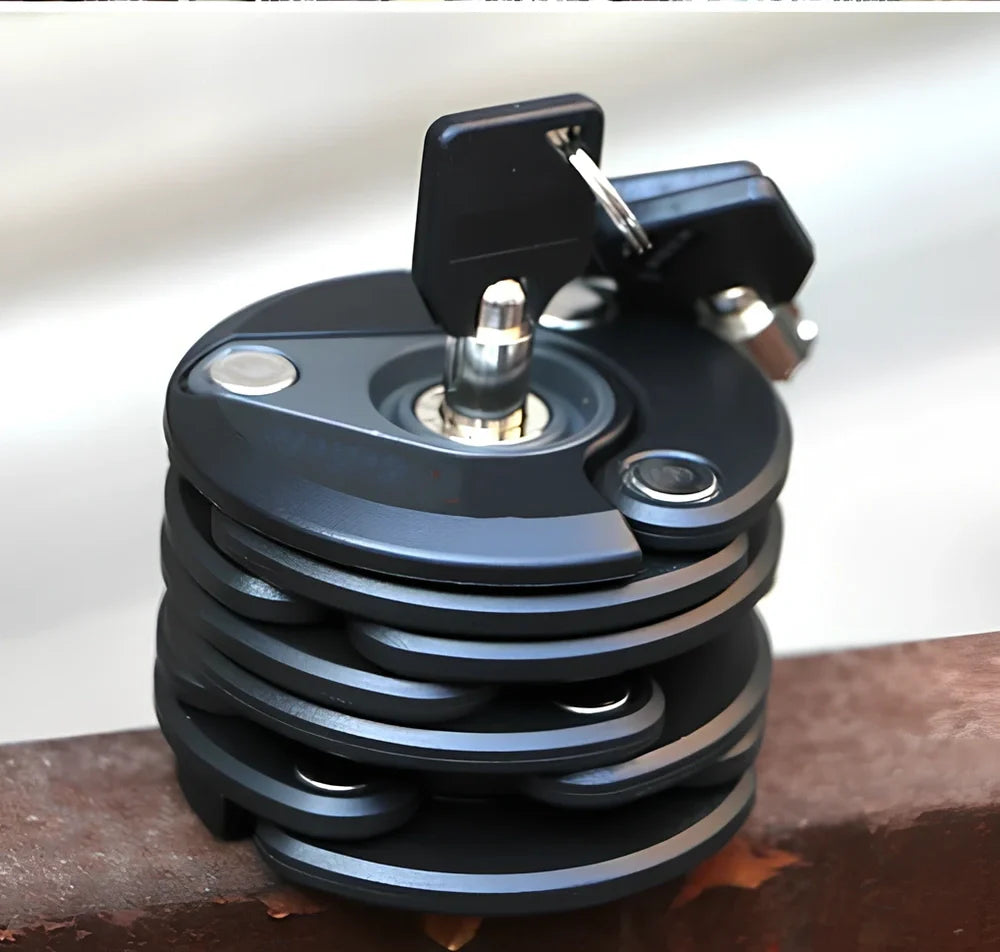 Black folding bicycle anti-theft chain lock, 585mm length with zinc alloy body and 3mm steel joints for secure bike protection