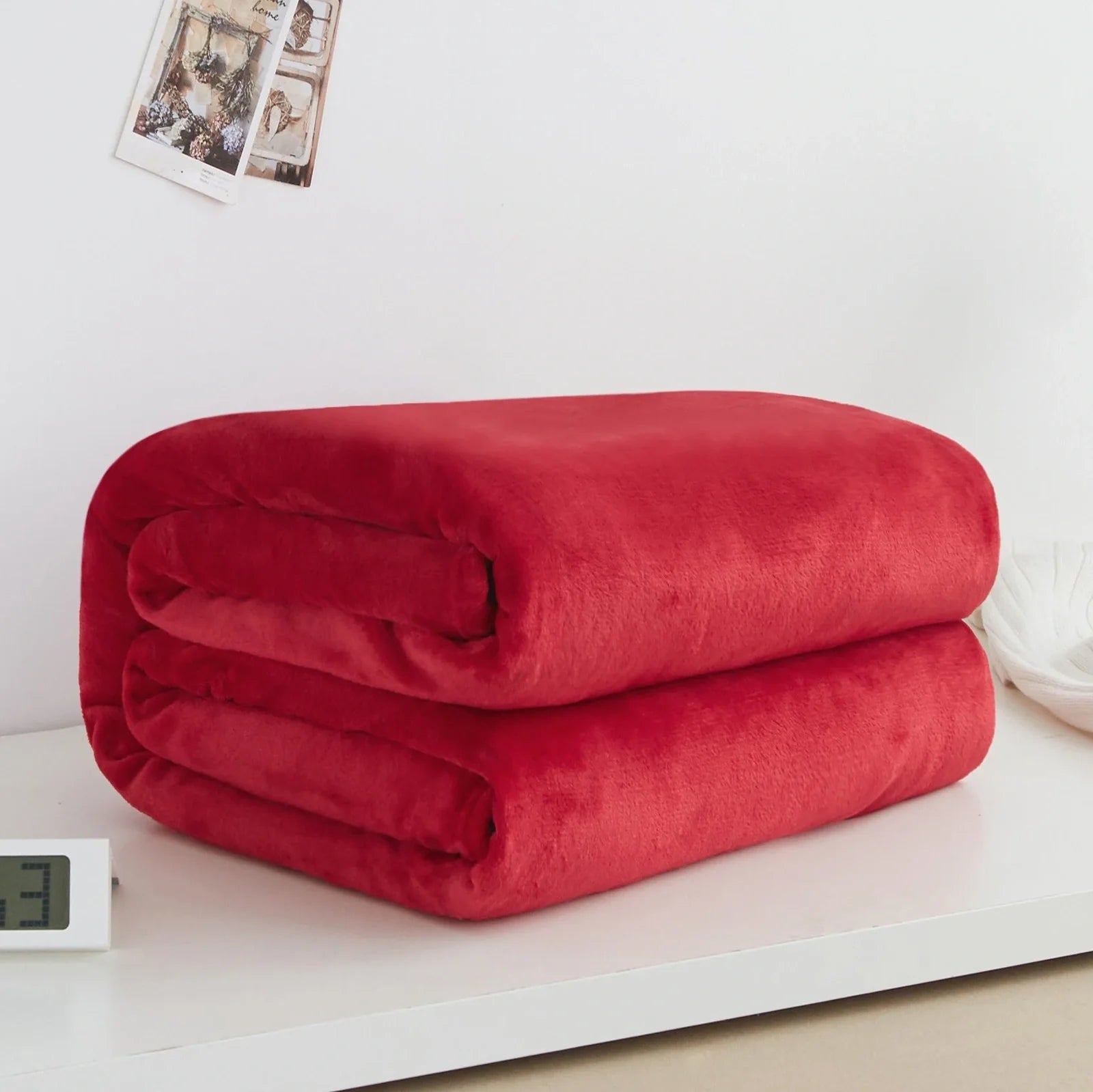 Coral fleece flannel blanket in beige showing textured surface and consistent edges