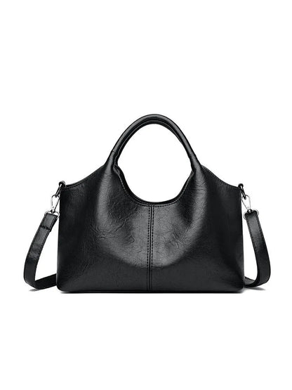 Soft genuine leather women's crossbody bag in beige with large capacity and adjustable strap.