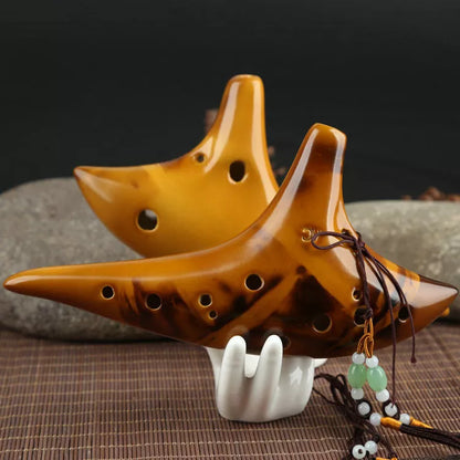 Ceramic 12-hole smoldering ocarina in alto C pitch with nest-inspired design