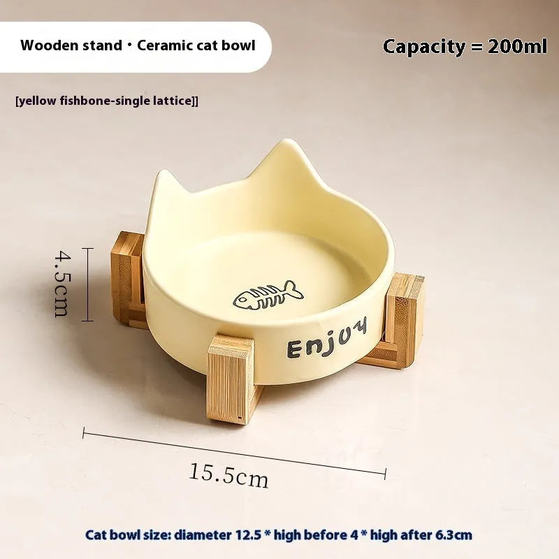 Porcelain cat bowl with anti-tumble wooden frame in pink with a cat paw design