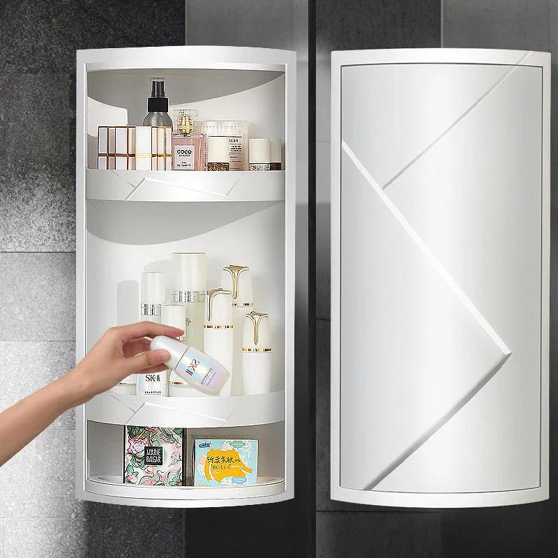 Rotatable bathroom storage organizer with a sleek, white plastic design and a covered front panel to protect against dust.