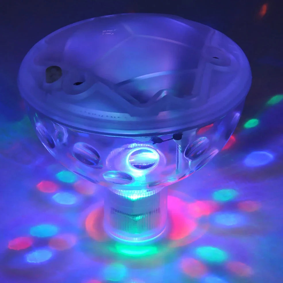 Children's floating LED bath lamp showing 8cm cube design with multiple colour lighting effects in water