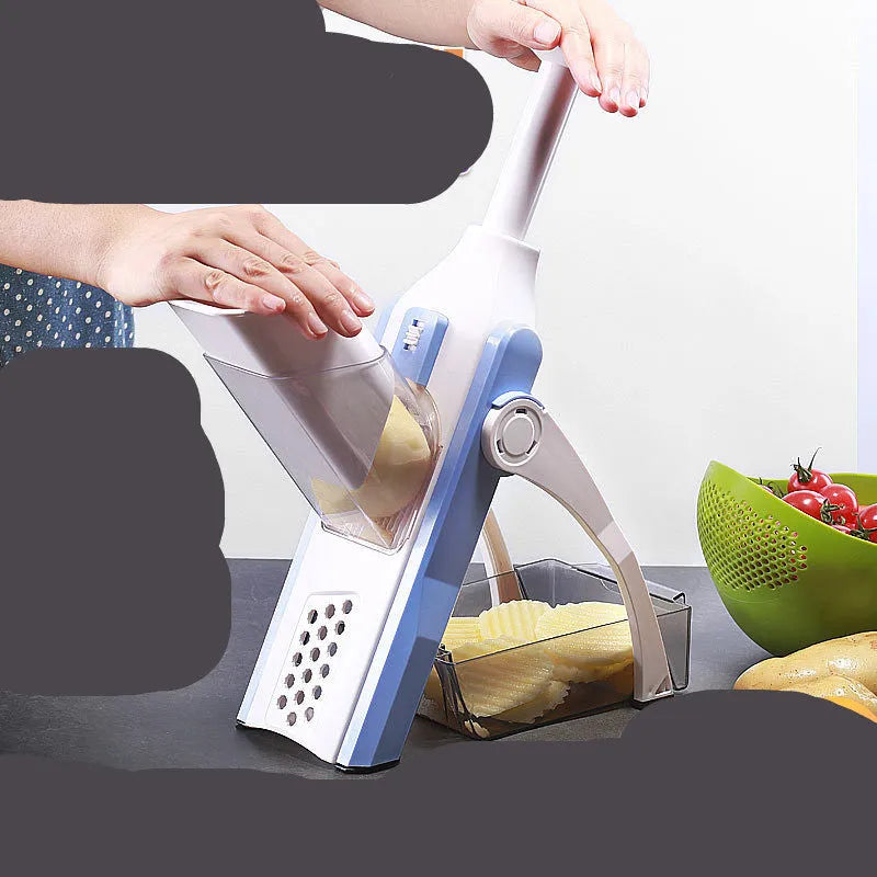 White and blue multifunctional vegetable slicer with stainless steel blades on a kitchen counter.