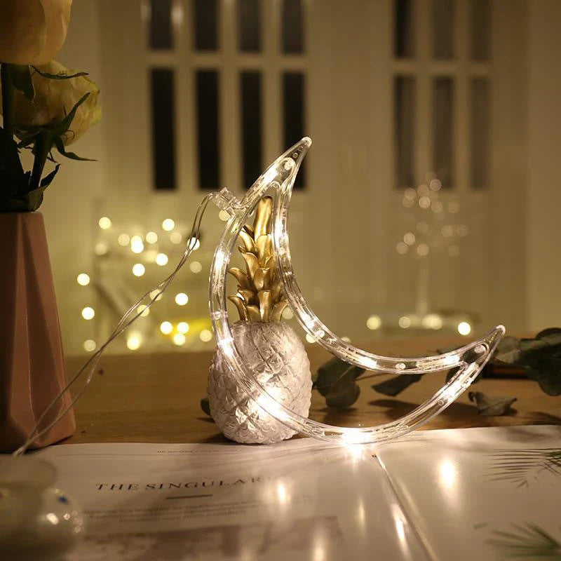 Decorative battery-powered LED chandelier lights with holiday-themed designs like Santa, snowmen, and stars
