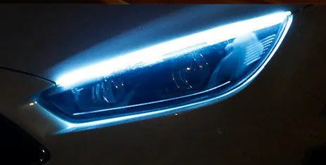 Car LED daytime running light strip with flowing turn signal function in silicone housing
