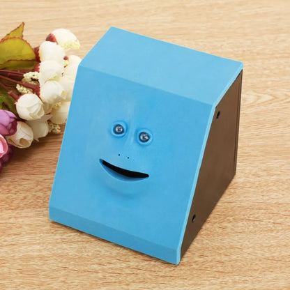 Face Intelligent Induction Electric Piggy Bank with realistic money-eating action in brick blue, pink, or red