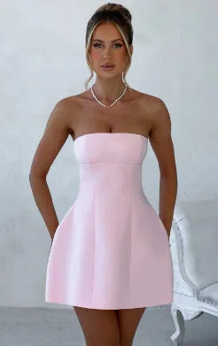 Backless women's tube dress in solid colour with high waist and A-line short skirt.