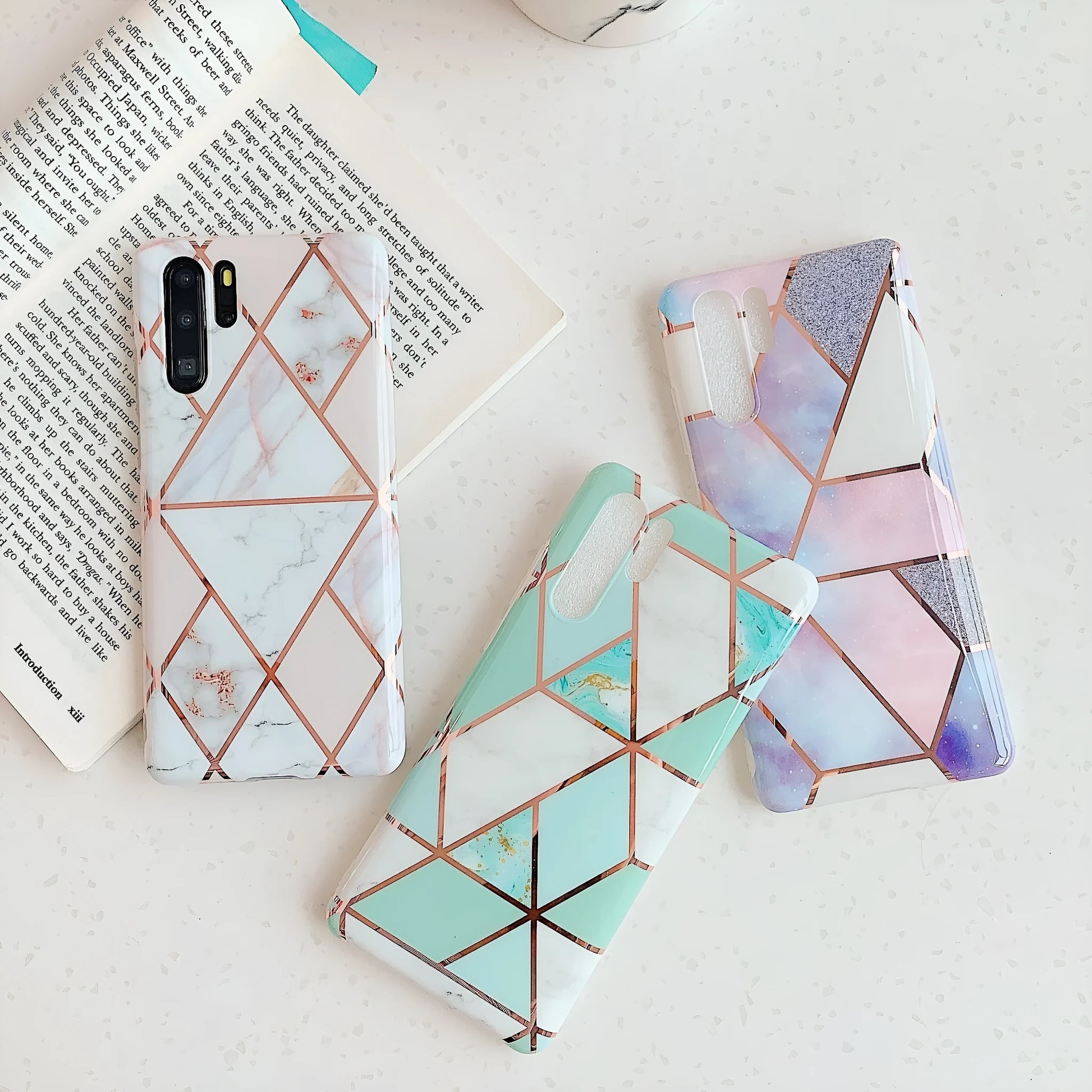 Electroplated marble mobile phone case in various colours for Huawei and Samsung models, showing slim TPU back cover design