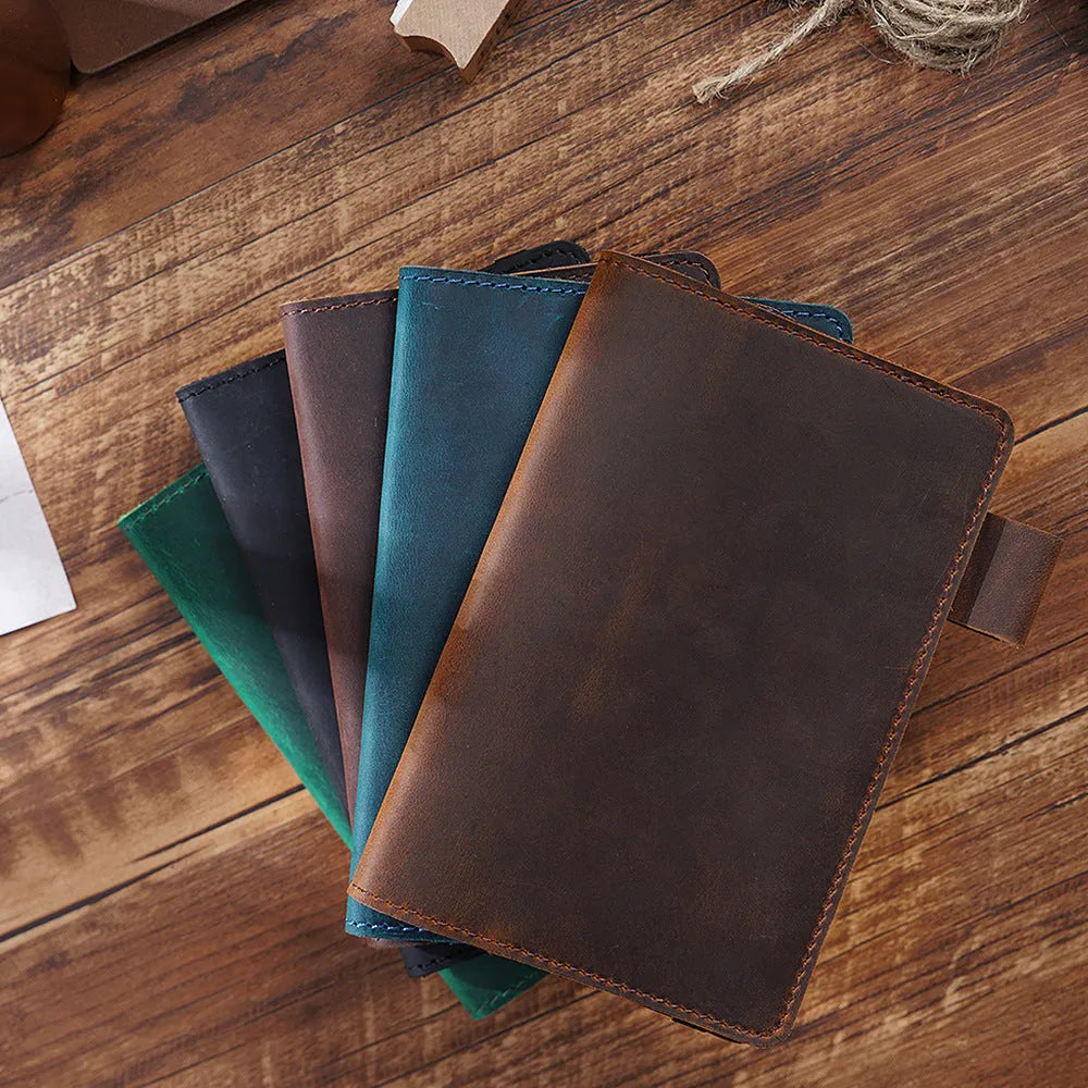 Handmade cowhide kraft notebook open showing wood-free paper, in dark green colour