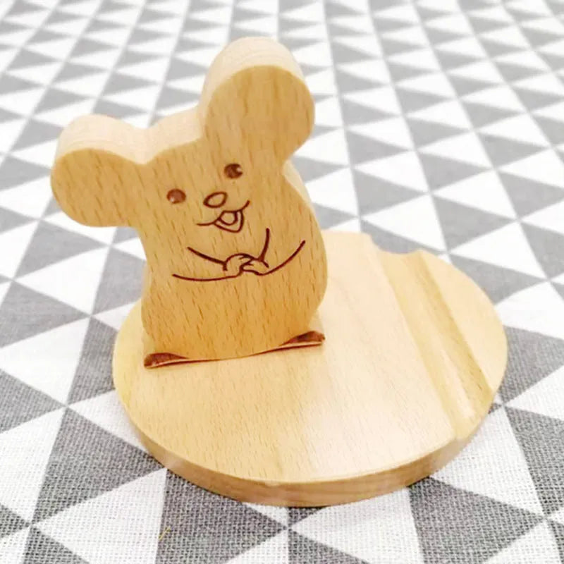 Beech wood mobile phone holder with coin slot showing adjustable angle and resin decorative elements