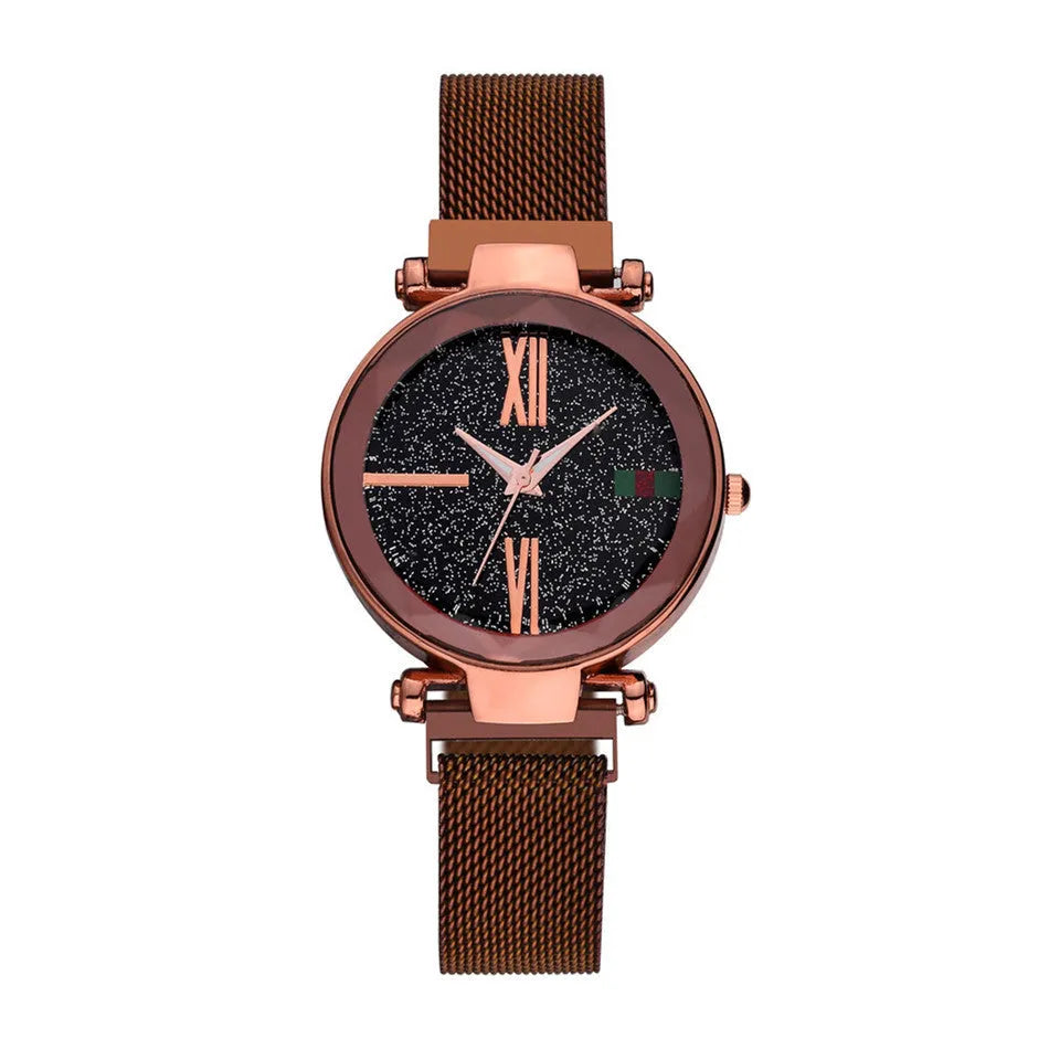 Rose gold ladies watch with round 32mm dial and magnetic stainless steel jewellery clasp on wrist.