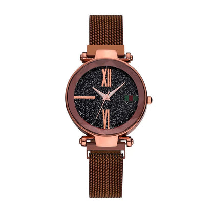 Rose gold ladies watch with round 32mm dial and magnetic stainless steel jewellery clasp on wrist.