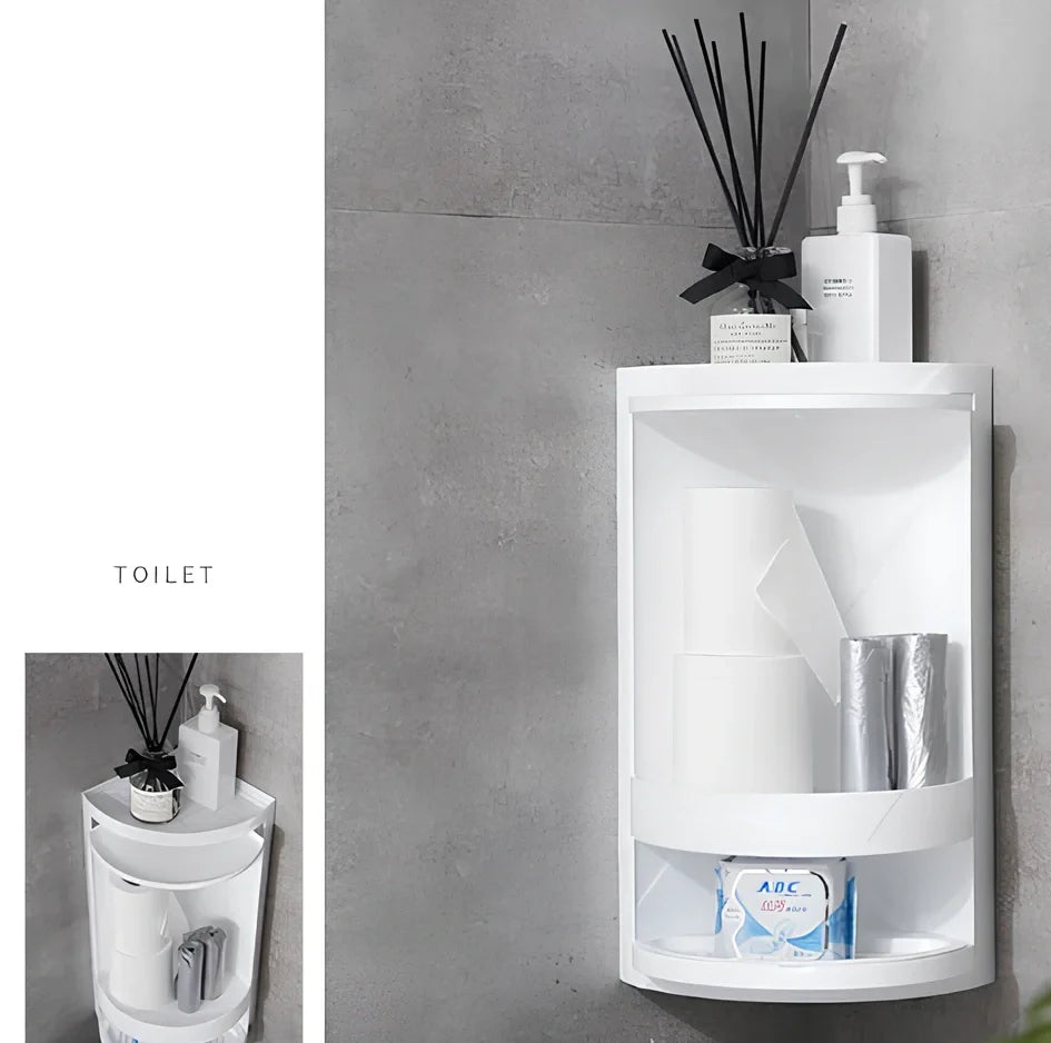 White triangle corner shelf with three tiers mounted in bathroom corner holding toiletries