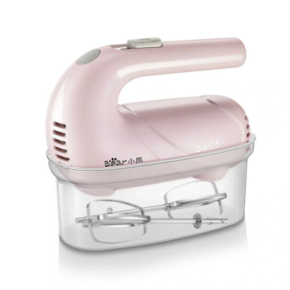 Pink electric hand whisk with stainless steel attachments for whipping eggs and cream
