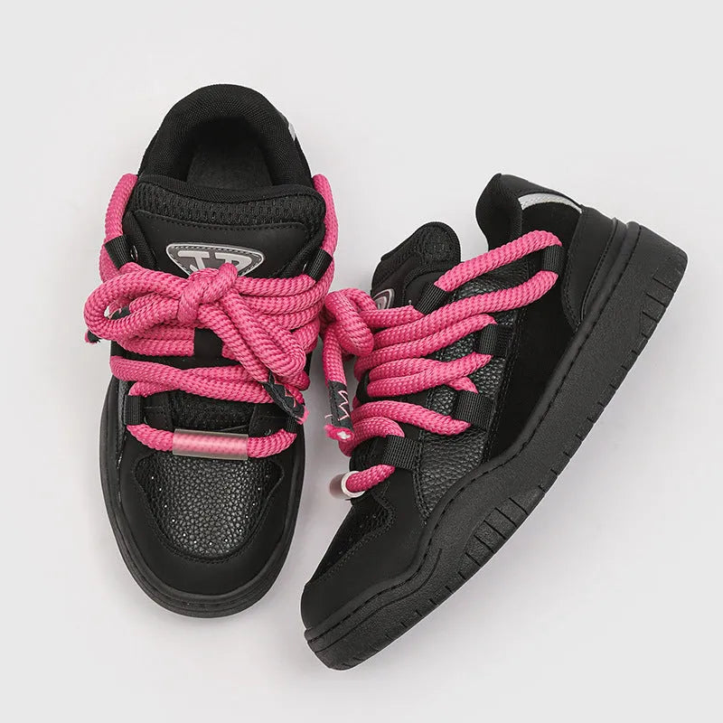 A pair of thick-soled casual lace-up shoes in a solid colour with a round toe and mesh lining.