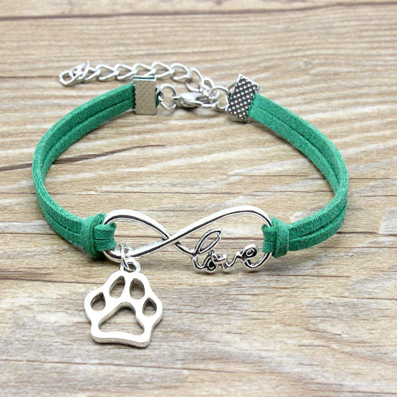 Hand-woven Infinite Love Pet Bracelet in various colors, showcasing the bow shape and alloy material.