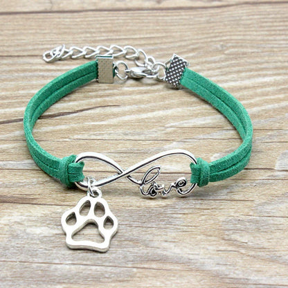 Hand-woven Infinite Love Pet Bracelet in various colors, showcasing the bow shape and alloy material.