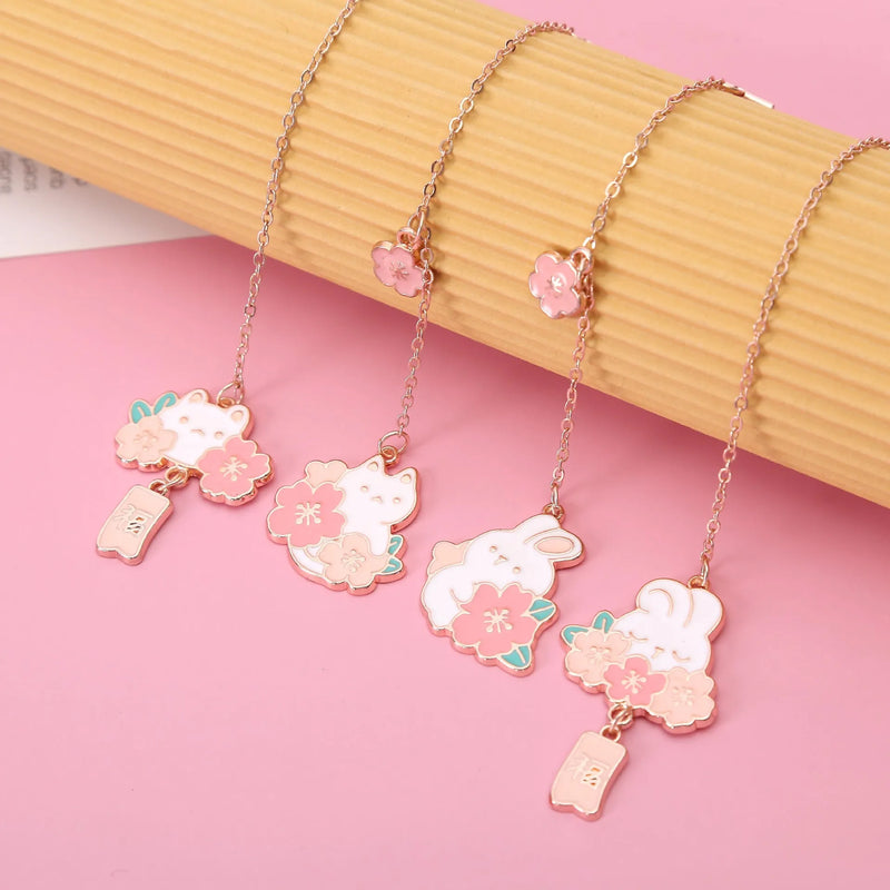 Metal bookmark and journal decoration pendant with cute cartoon cherry blossom cat and rabbit designs, small book holder charm for student stationery and page marking, includes fu character variations for creative gift options