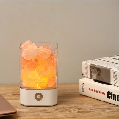 Himalayan salt lamp with warm, soothing glow and color-changing capabilities for air purification and relaxation