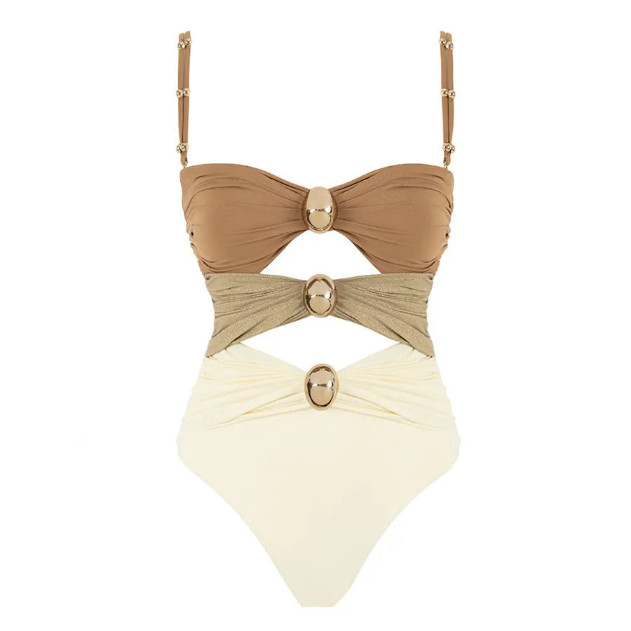 Women's green one-piece swimsuit with round buckle decoration and hollow-out stitching detail on nylon fabric.