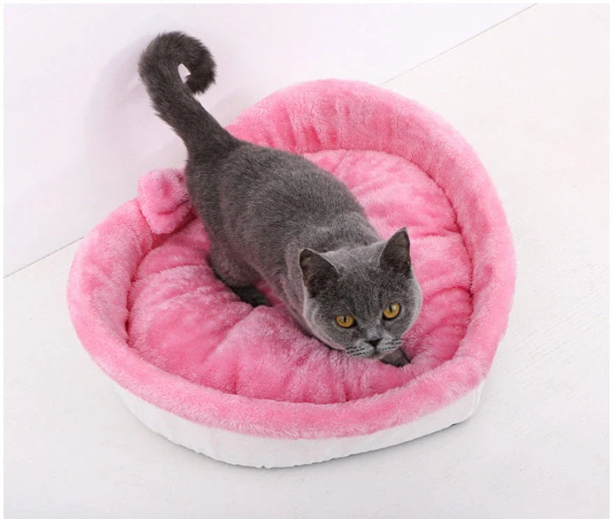 Cozy heart-shaped pet bed in grey and pink colors, suitable for cats and small dogs