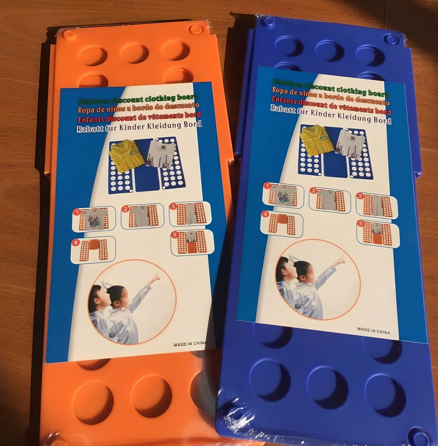 Adjustable clothes folding board showing 40x48cm and 68x57cm sizes with PP+PE construction