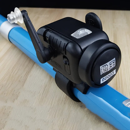 Black sea fishing bite alarm with ABS shell and polymer mounting belt for rod attachment