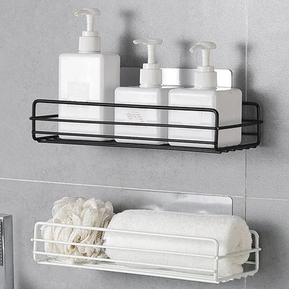 Black wrought iron bathroom shelf, 60cm long with drainage holes, holding shampoo bottles over tub edge