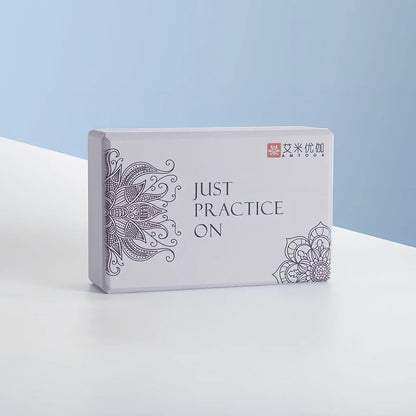 Black mandala pattern yoga brick measuring 23cm with textured surface for enhanced grip during yoga practice