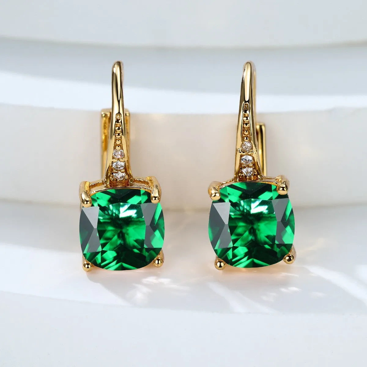 Square zircon inlaid ear hook earrings with geometric design and electroplated finish in golden tone