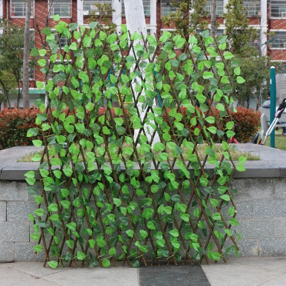 Plastic simulation wooden fence panel showing realistic wood grain texture in outdoor setting