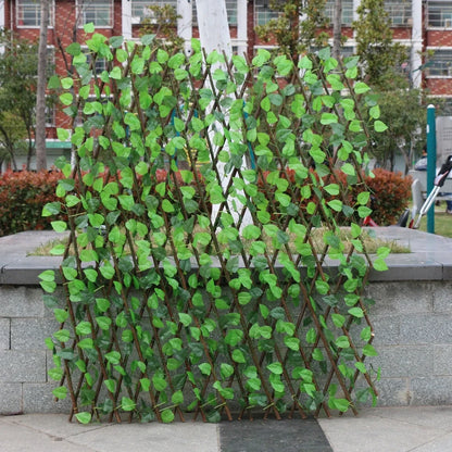 Plastic simulation wooden fence panel showing realistic wood grain texture in outdoor setting