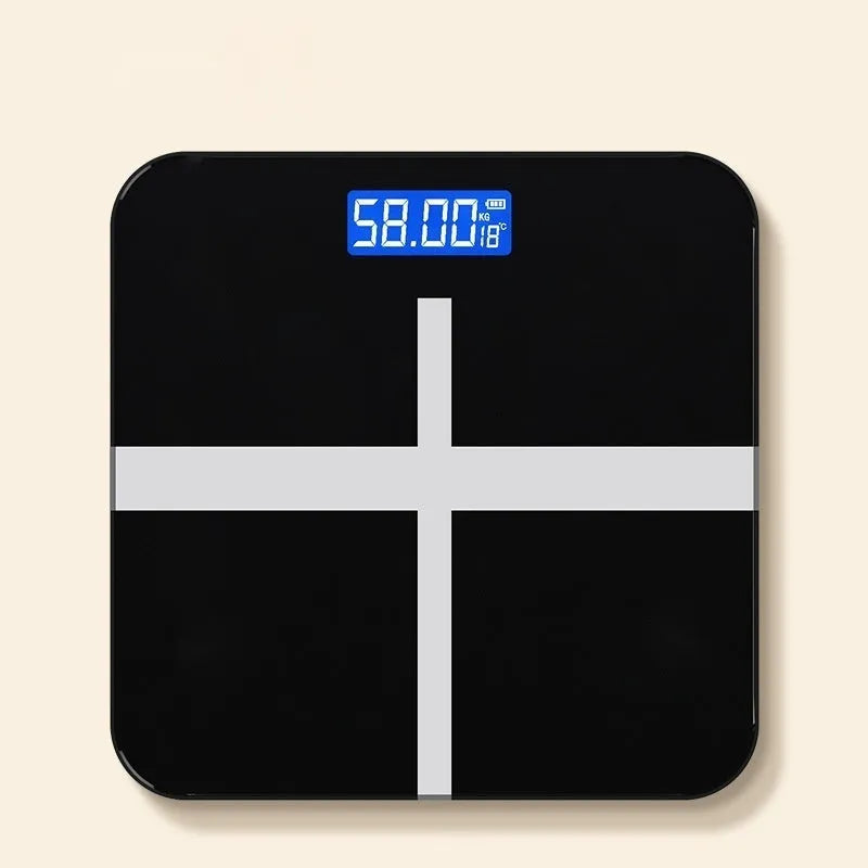 Household digital bathroom scale with large tempered glass top in rose gold finish on white bathroom floor.
