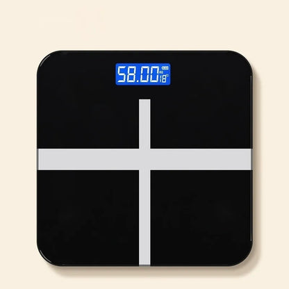 Household digital bathroom scale with large tempered glass top in rose gold finish on white bathroom floor.