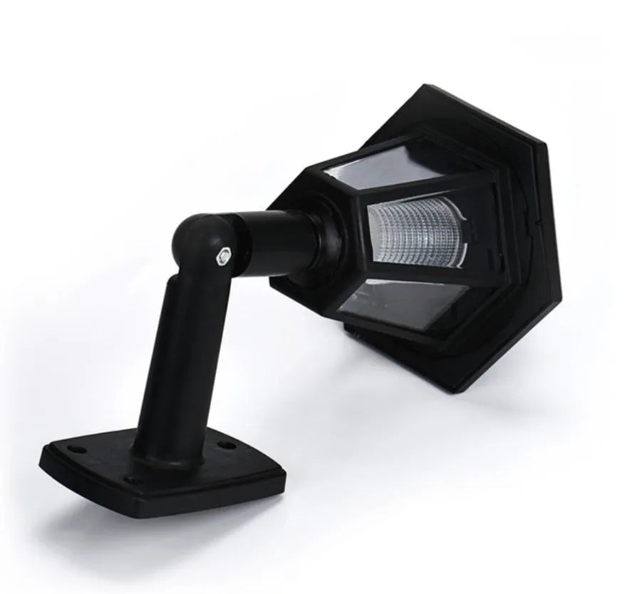 Black hexagonal solar-powered wall lamp for outdoor garden or patio lighting