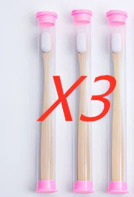 Bamboo toothbrush with wood colour handle measuring 18.5cm long with soft white bristles in protective tube