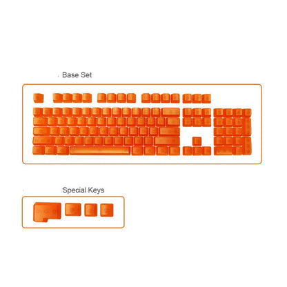 Set of 104 transparent blank PBT keycaps for mechanical keyboards in orange, white, blue, and black colours.
