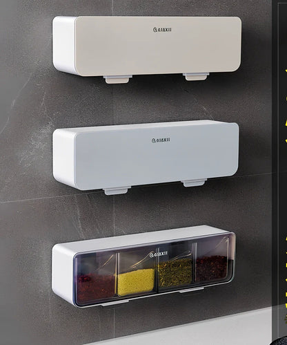 Wall-mounted plastic spice box set with multiple compartments and measuring spoon in kitchen