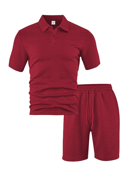 Men's patterned cloth casual suit set with short sleeve polo top and trousers on a hanger.