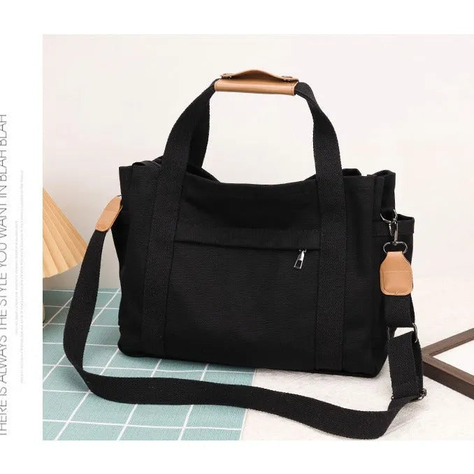 Army Green canvas tote bag showing open top with internal laptop pocket and organisers.