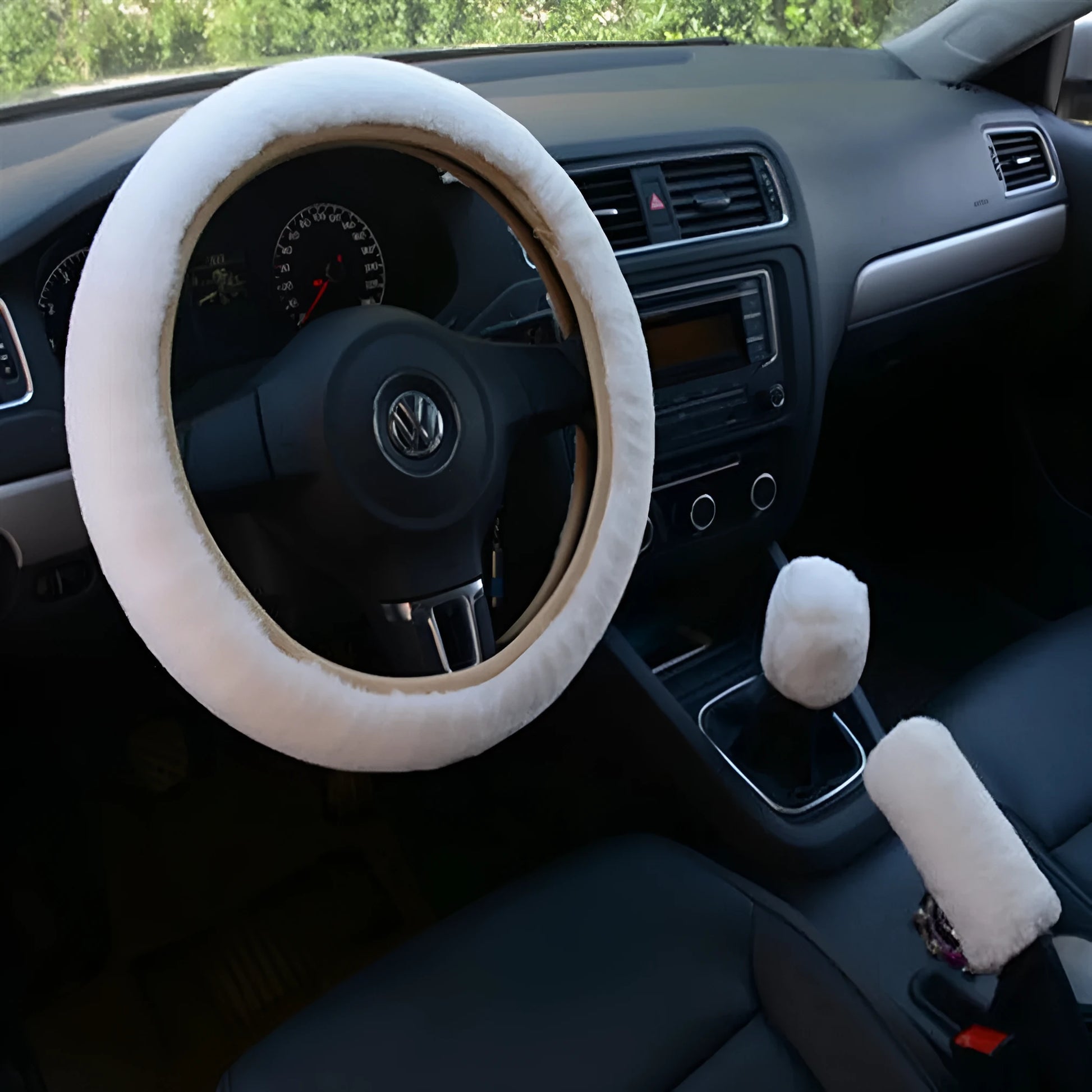 Plush winter car steering wheel cover set in six colours with matching brake and gear lever covers.