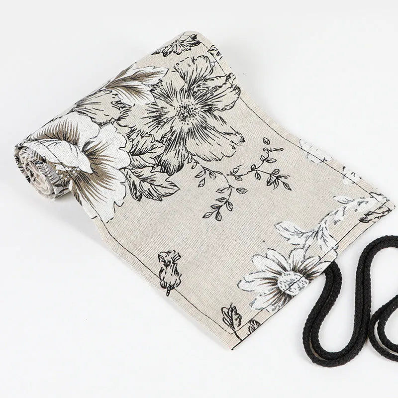 Black peony floral print canvas pencil roll bag open to show 24 or 72 pencil slots.