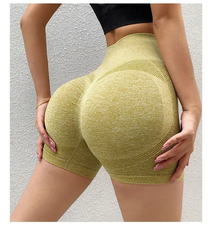 Women's high-waisted black seamless yoga shorts for fitness and running.