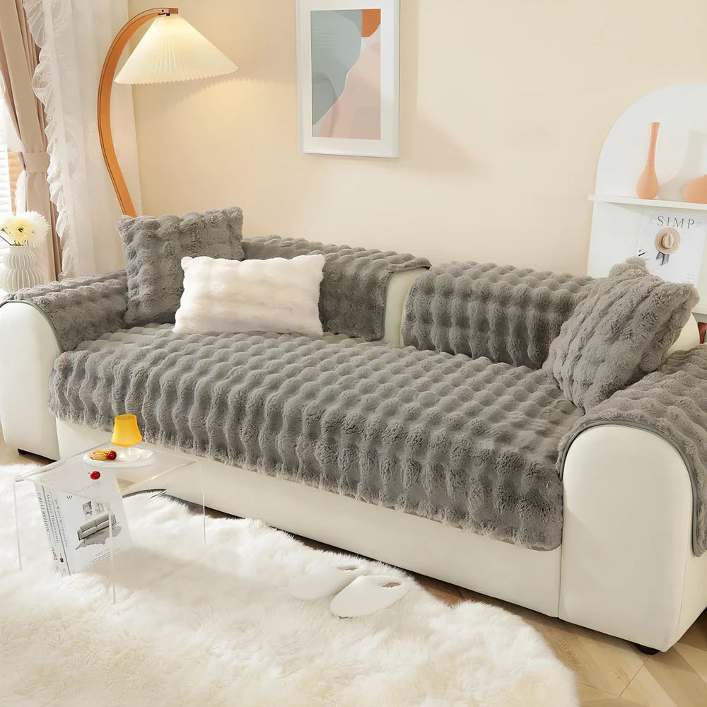 Square flannelette sofa cushion in light blue colour measuring 110x160cm on grey fabric sofa